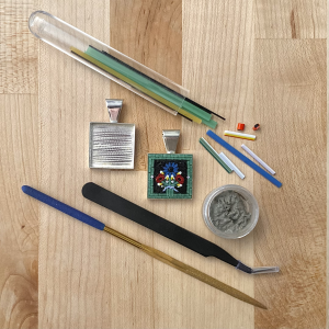 Tools and supplies for creating a micromosaic pendant.